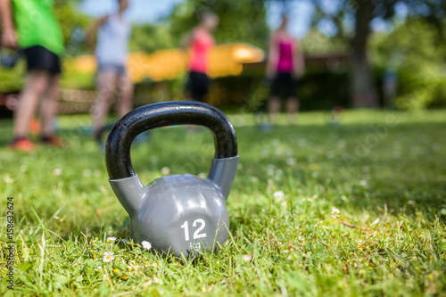 Kettle bell on grass in a park