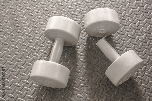 broken dumbbell and on black background