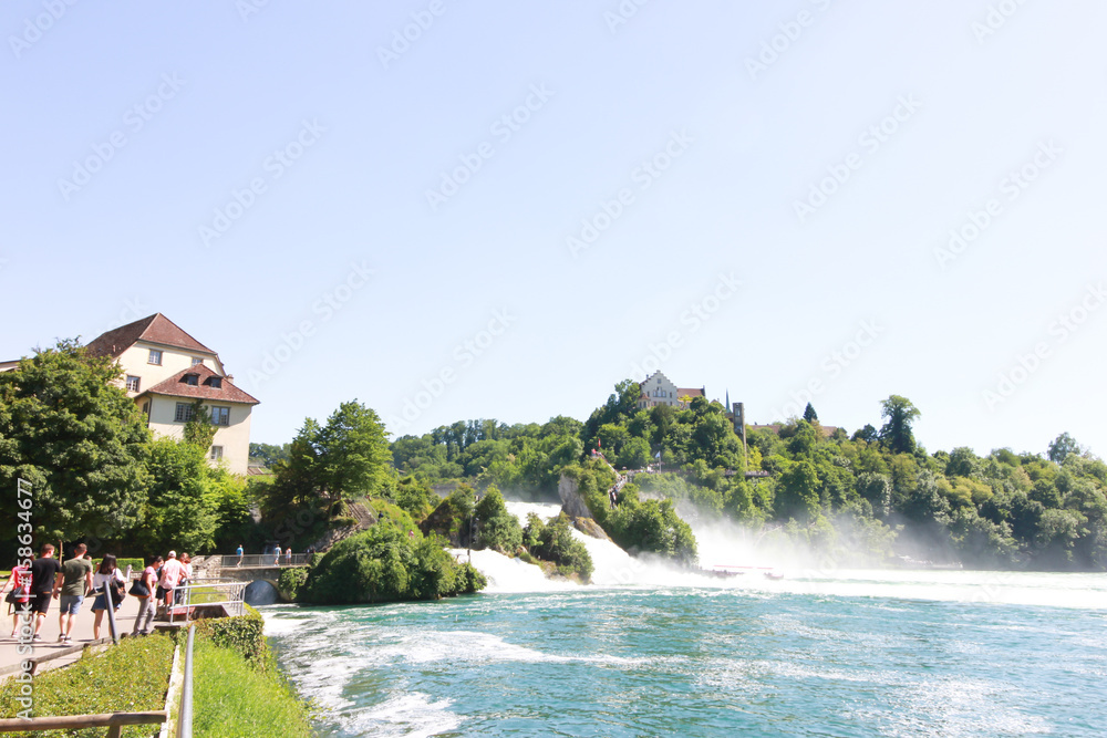 The Rhine Falls in Schaffhausen, Switzerland. - May ‎27, ‎2017 : The Rhine Falls in Schaffhausen. During the high season of Switzerland, so many tourists travel a lot. To find the beauty.