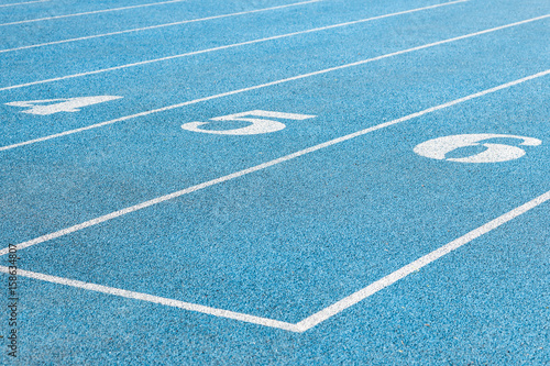blue running track with numbers