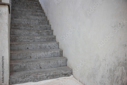 Old stair way inside old building with clear concrete wall