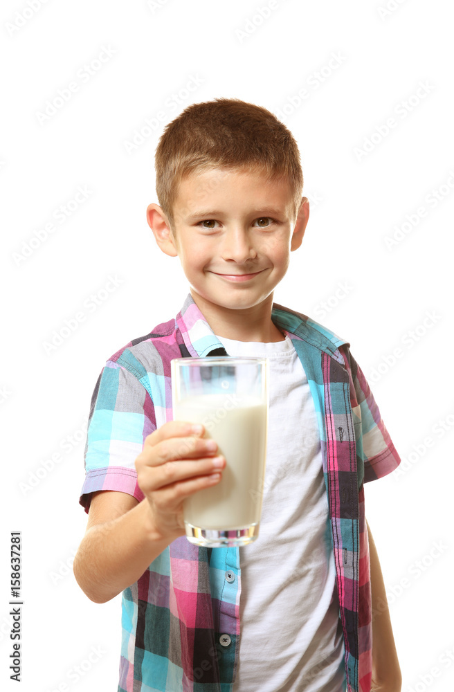 Smiling little boy holding glass of milk isolated on white Smiling little boy holding glass of milk isolated on white