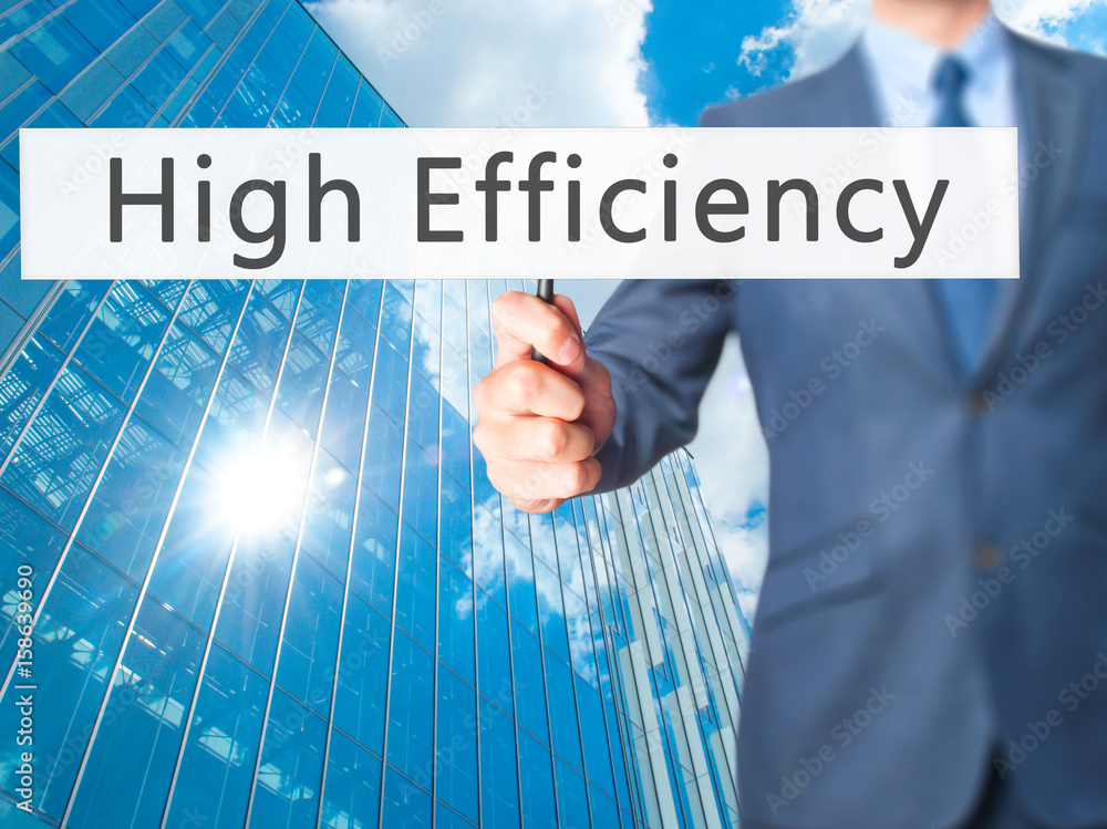 High Efficiency - Businessman hand holding sign High Efficiency - Businessman hand holding sign