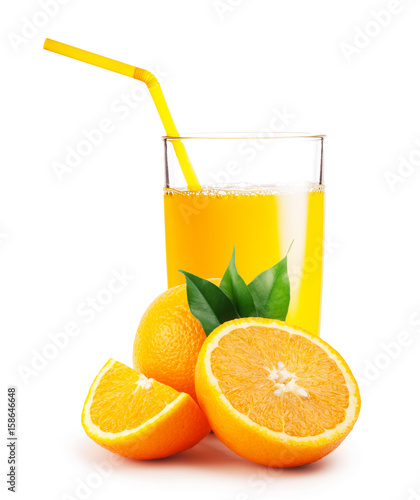 Glass of orange juice and the oranges