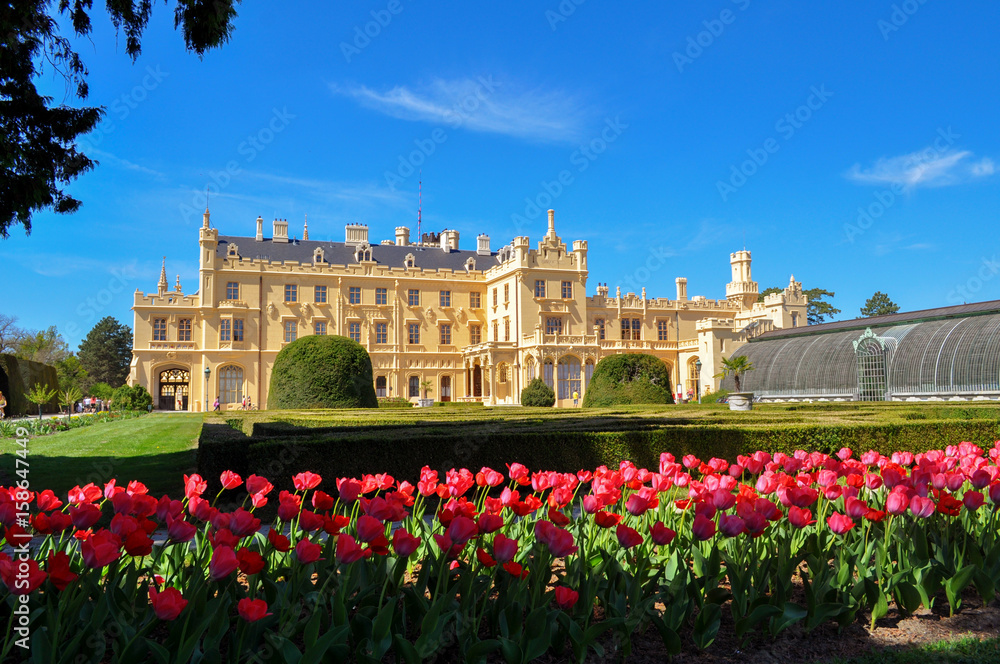 Beautiful Lednice chateau with tulips in the foreground, located in South Moravia in the Czech Republic