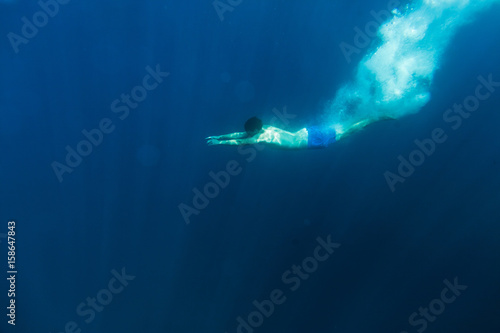 man dive underwater