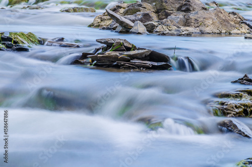 Background of Carpathian mountain river with long exposure