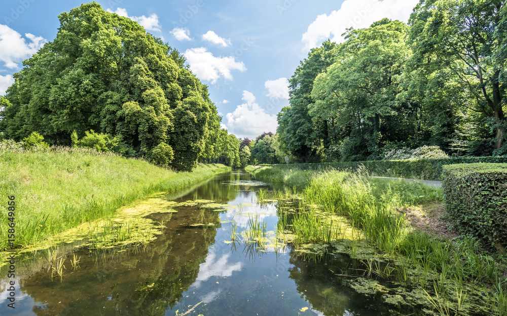 Ditch around the medieval castle De Haar in Netherlands