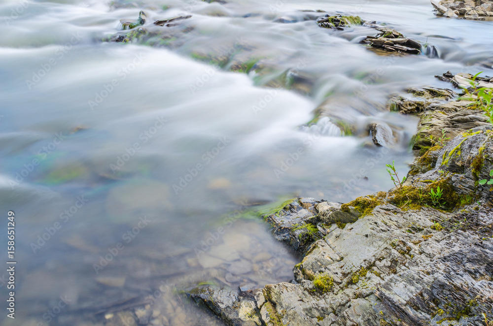 Background of Carpathian mountain river with long exposure Background of Carpathian mountain river with long exposure