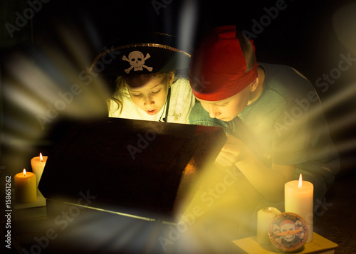 Cute girl and adventurous boy found a treasures. Happy young pirates.