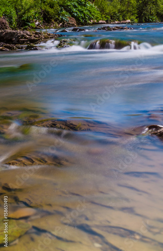 Background of Carpathian mountain river with long exposure