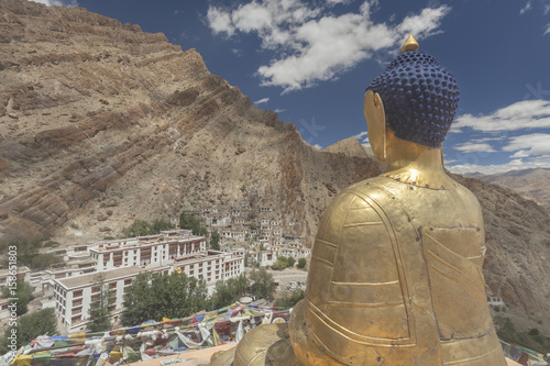 Buddha statue at Hemis Monastery looking into valley, Leh, Ladakh, India photo