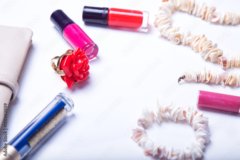 Women's accessories spring-summer: lipstick, varnish, purse, jewelry, mascara Women's accessories spring-summer: lipstick, varnish, purse, jewelry, mascara