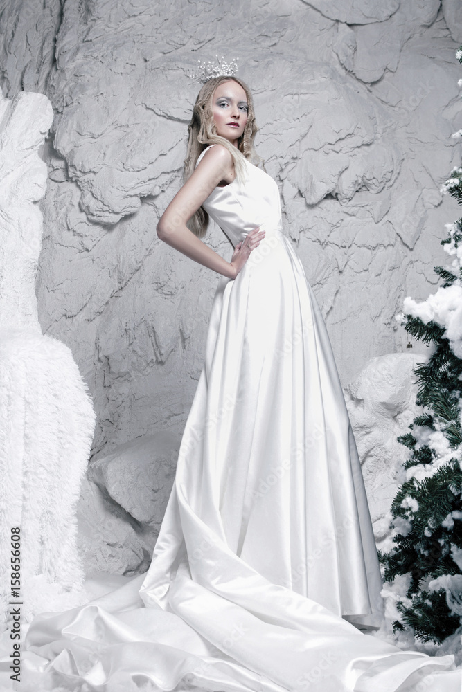 snow queen standing in ice cave snow queen standing in ice cave