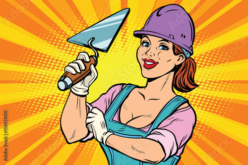 Construction worker with trowell. Woman professional