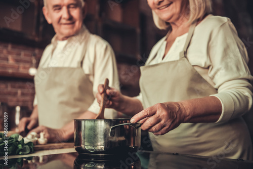 Old couple in kitchen