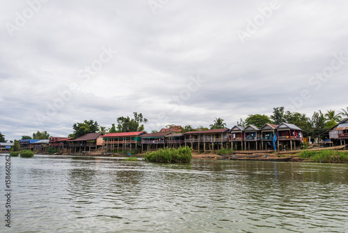 Old wooden houses along the Mekong river in Laos, Dondet city.