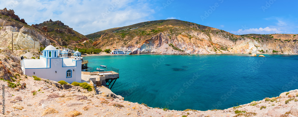 Panoramic view of the Firopotamos Bay, a fishing port and a beach with amazing blue water. Milos, Cyclades Islands, Greece