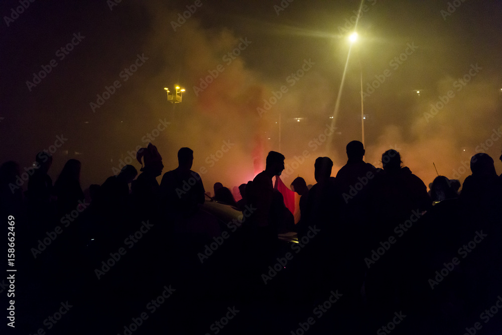 Silhouettes Of Protesters