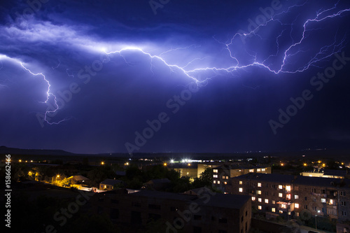 lightning in the sky in the city weather anomaly disaster