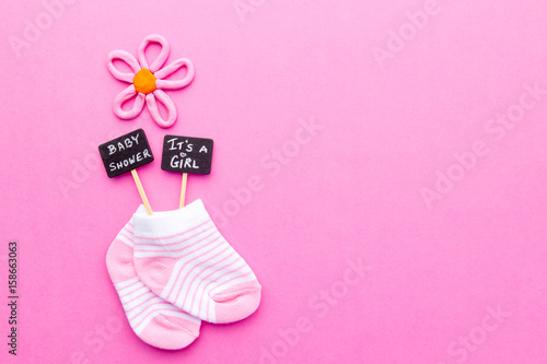 Baby Girl announcement - pink and white socks on pink background with Baby  Shower and It's a Girl blackboard signs Stock Photo | Adobe Stock