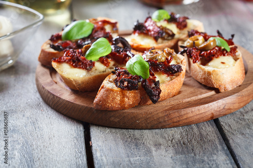 Wallpaper Mural Appetizer bruschetta with sun-dried tomatoes, olives and mozarella. Torontodigital.ca