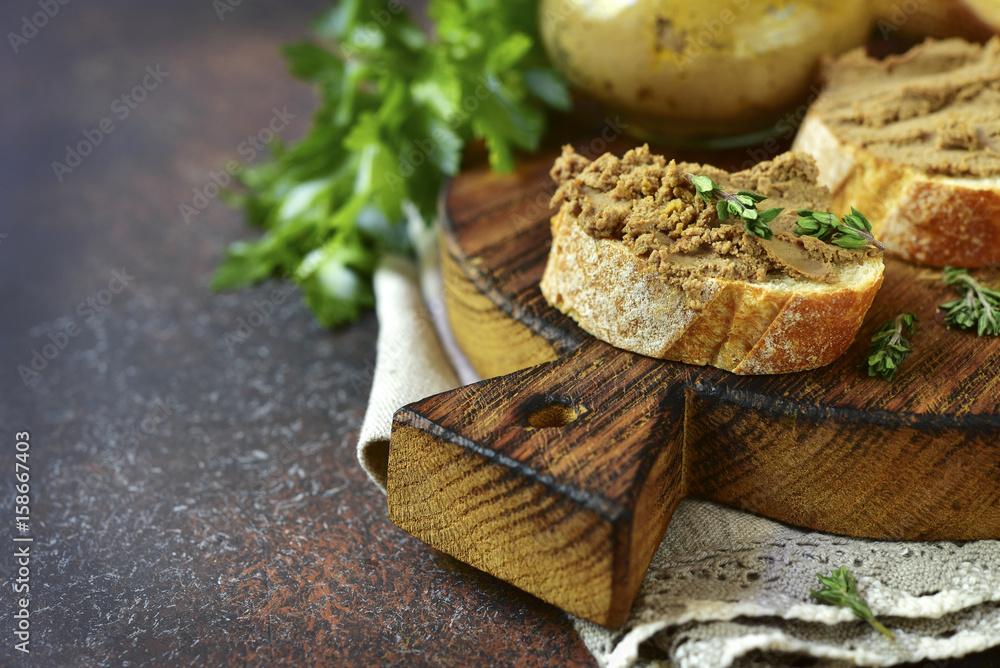 Homemade liver pate with vegetables and thyme.Rustic style.