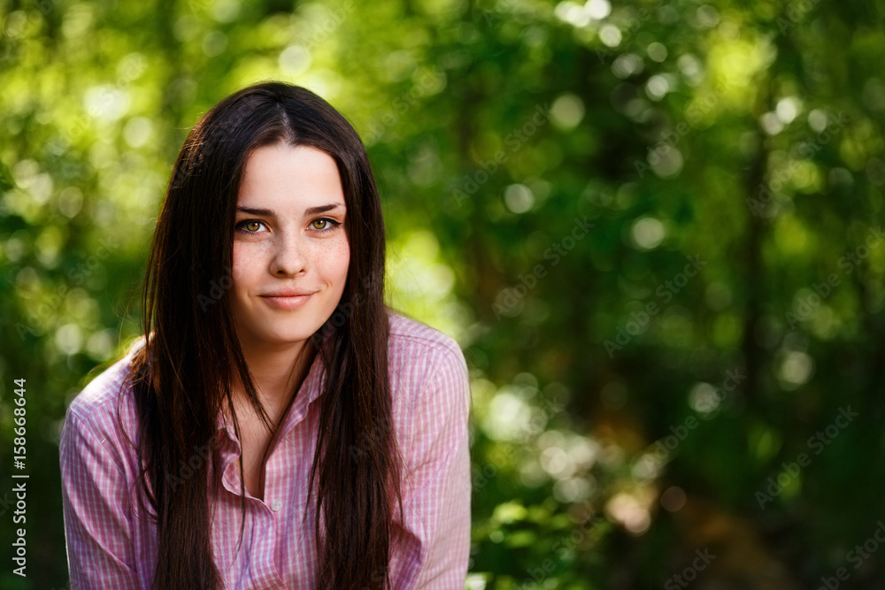 Young beautiful freckled green-eyed woman with healthy skin and light smile, cropped portrait Young beautiful freckled green-eyed woman with healthy skin and light smile, cropped portrait