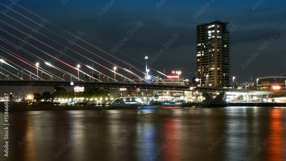 Rotterdam, The Netherlands - May 2017: Erasmusburg bridge at night by Noordereiland