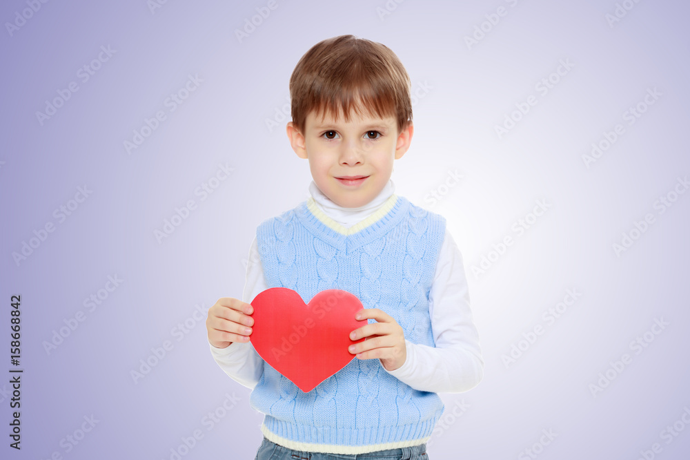 The little boy holds in his hand and heart. The little boy holds in his hand and heart.