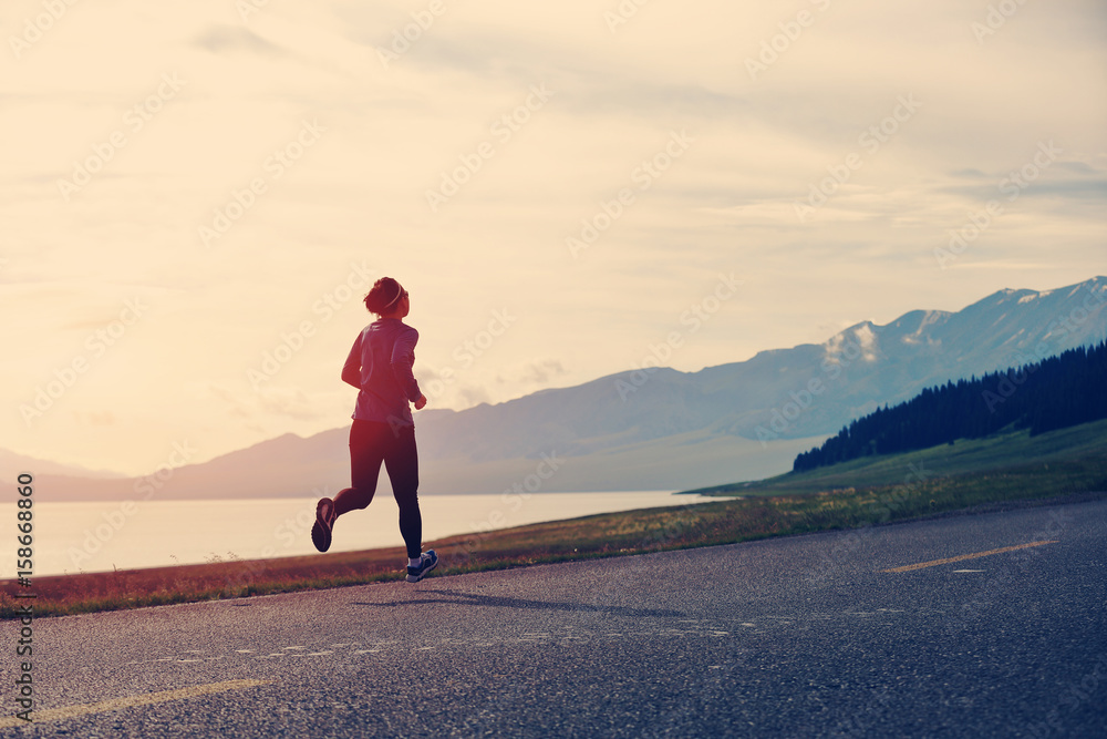 Healthy lifestyle young fitness woman runner running on road Healthy lifestyle young fitness woman runner running on road