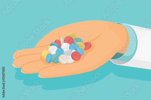 Doctor holds a handful of pills in hand. Medical healthcare conc