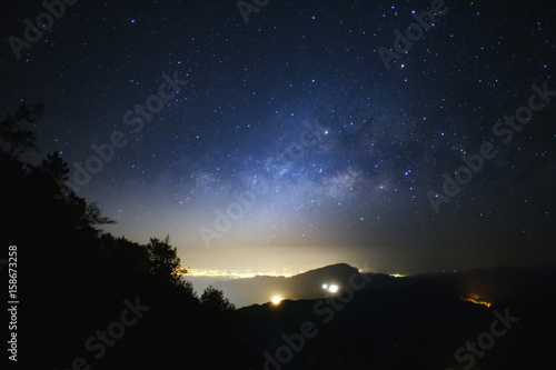 Milky Way Galaxy with light city at Doi inthanon Chiang mai  Thailand.Long exposure photograph.With grain