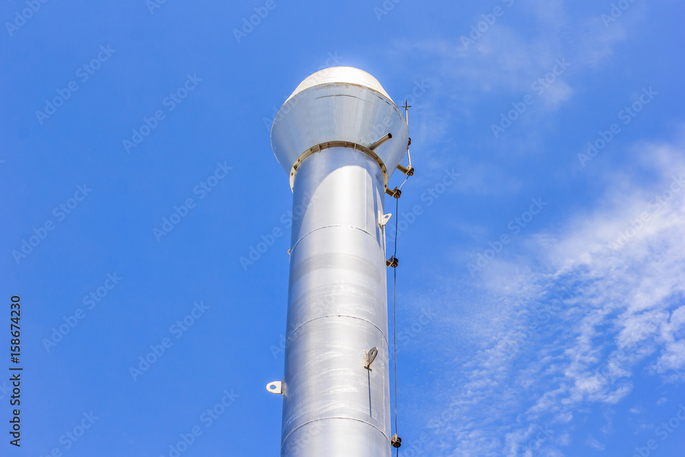 Industrial boiler flues against the blue sky Industrial boiler flues against the blue sky