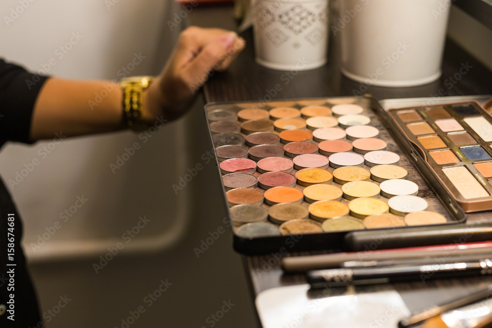 Cosmetic palette with the shadows lying on the table. Cosmetic makeup, women's beauty Cosmetic palette with the shadows lying on the table. Cosmetic makeup, women's beauty