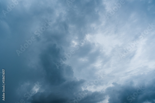 clouds with background,sunlight through very dark clouds background of dark storm clouds,black sky Background of dark clouds before a thunder.