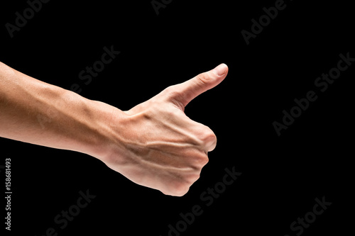 Male hand on a black background.