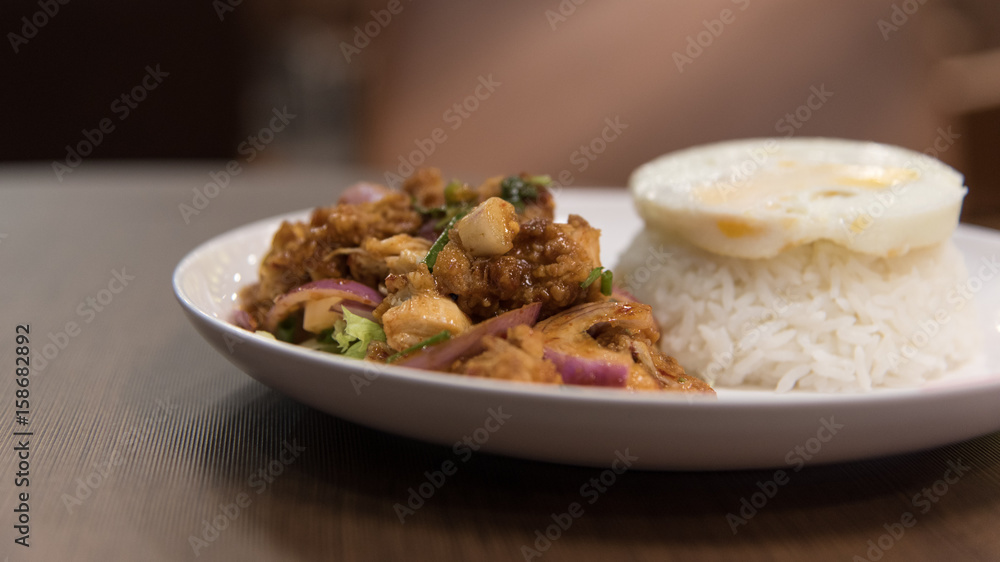 Fried chicken spicy salad with rice and fried egg Fried chicken spicy salad with rice and fried egg