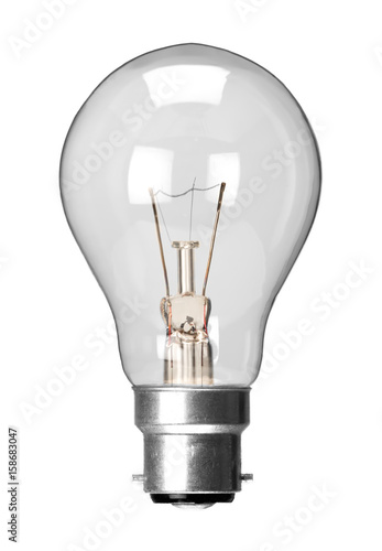 Fotografering Incandescent tungsten filament light bulb with bayonet fitting, isolated on a wh