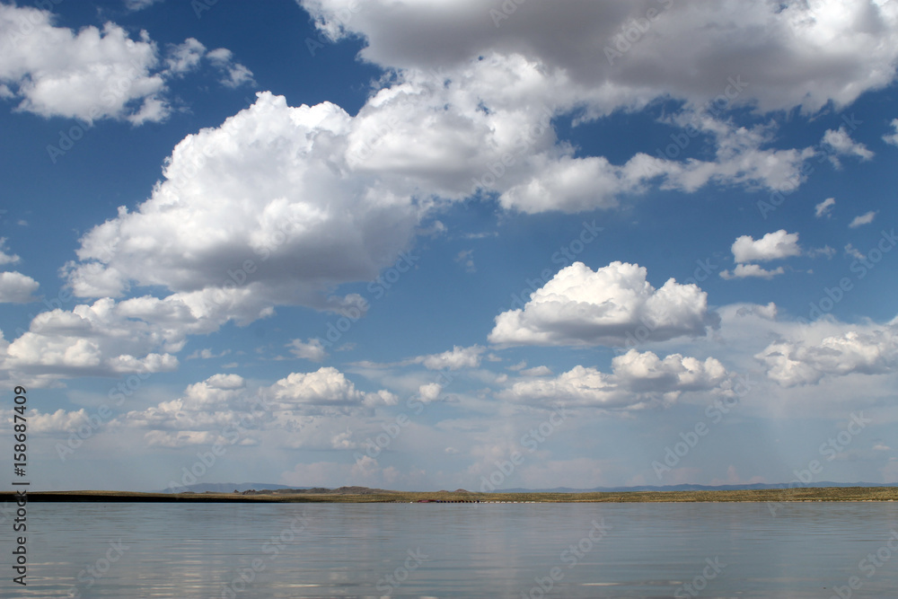 the sky reflected in the water, deserted beach lake, summer sky, nature, blue cloud,