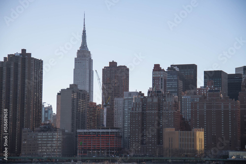 Empire State Building and buildings in Manhattan under the shade © Spinel