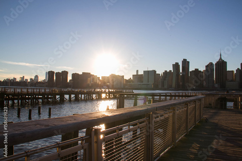 Manhattan city with sunset and pier at Gantry Plaza State Park over the river #158689823