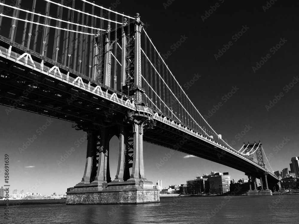 Manhattan bridge over East river in black and white