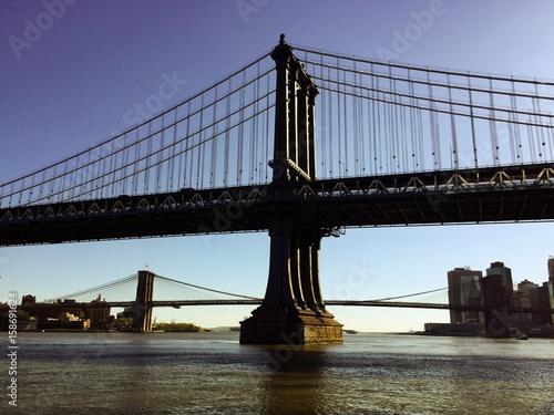 Manhattan bridge and Brooklyn bridge over the river in vintage style © Spinel