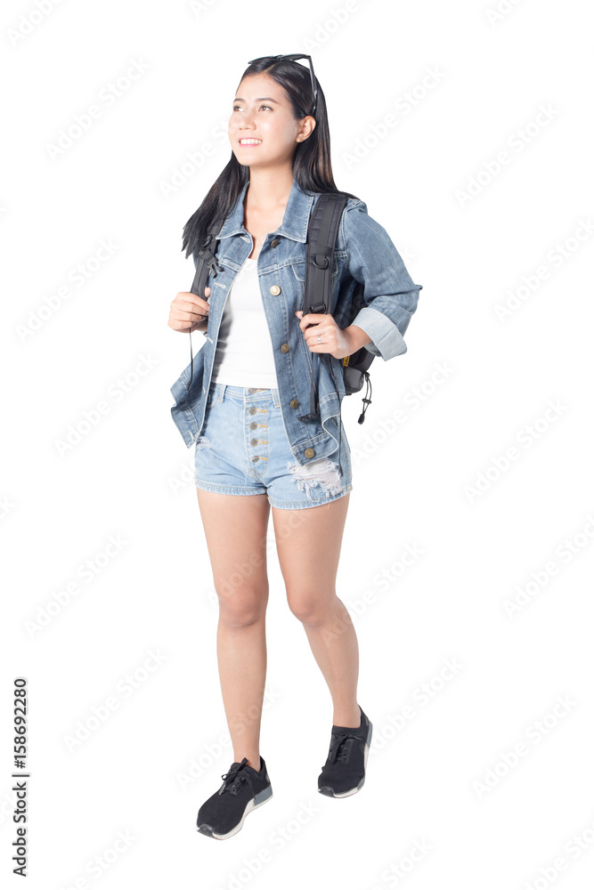 Portrait of a joyful asian woman hiker jumping in the studio while carrying a backpack, isolated on white background with paths, 20-28 year old. Portrait of a joyful asian woman hiker jumping in the studio while carrying a backpack, isolated on white background with paths, 20-28 year old.