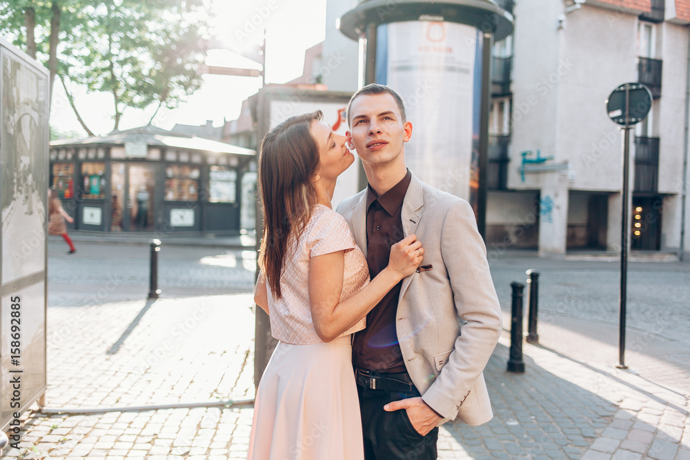 beautiful couple kissing on the street in summer beautiful couple kissing on the street in summer