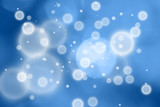 Abstract blurred circle shape pattern on blue colored background.