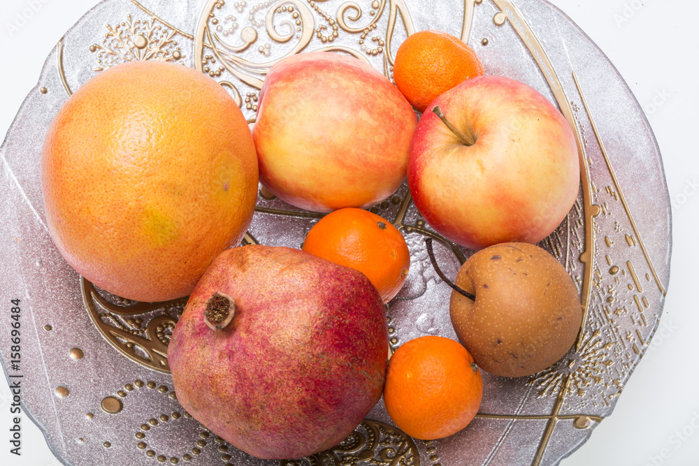 mix fresh fruits on plate isolated on white mix fresh fruits on plate isolated on white