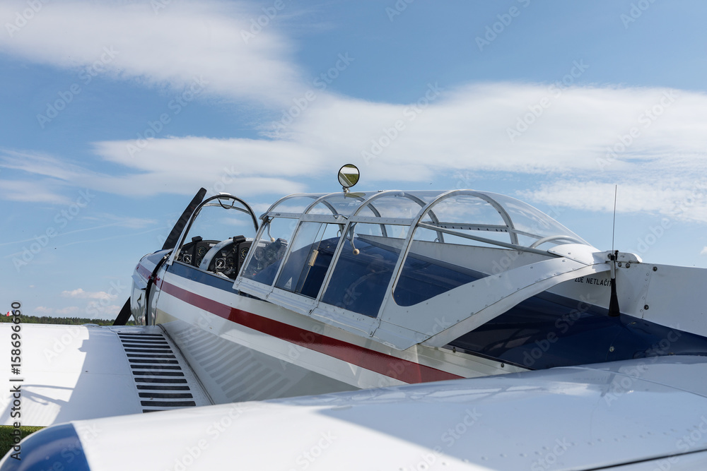 Two seat single engine civil utility aircraft, white small plane, red and blue strip is towed by a glider on a sunny day Two seat single engine civil utility aircraft, white small plane, red and blue strip is towed by a glider on a sunny day