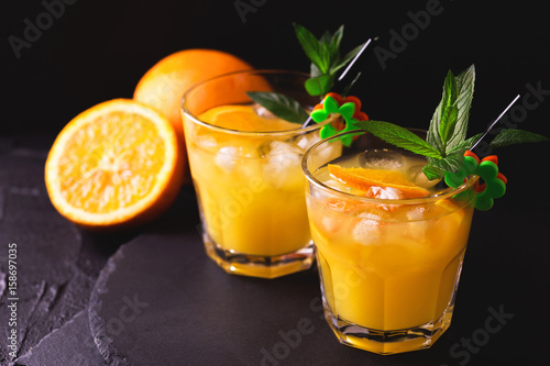 Aperitif with vodka, orange juice and mint. Screwdriver cocktail